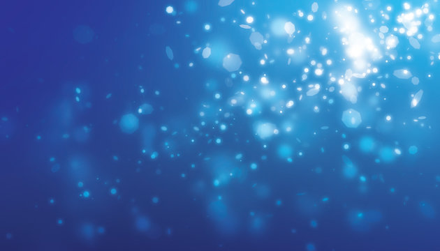 Blue glitter blur effect and dot light falling from side scene with blue background