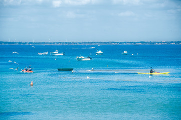 Man in his Kayak at sea in summertime on the isle of Noirmoutier