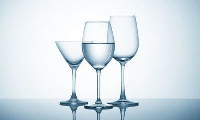 Glasses with water on blue background