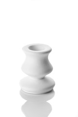 white candlestick, plaster closeup on a white background