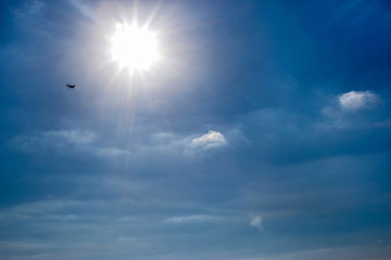 blue sky with clouds and sun