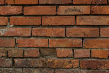 The brick texture, wall, with cracks and scratches can be used as a  background