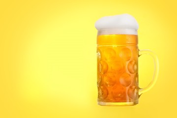 Golden beer in glass with foam, alcohol beverage,  pint.