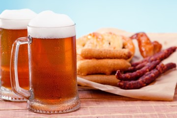 Beer glass alcohol drink with food sausage,  grilled.