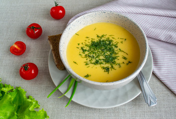 Lentil cream soup in a bowl on linen fabric. Dietary vegetarian food. Healthy food