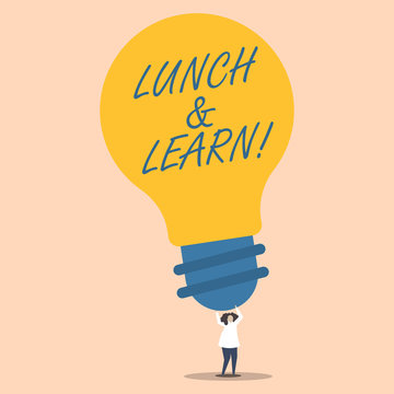 Word writing text Lunch And Learn. Business photo showcasing defiend as seminar offered during free lunch to test it Person Standing and Raising Up Arms Holding Big Yellow Lightbulb for Ideas