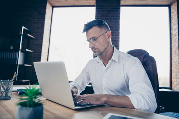 Close side profile up photo handsome he him his macho guy ponder pensive have investors online currency business chat letter attentive notebook table sit office chair wear specs formalwear white shirt