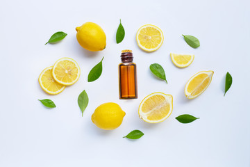 Fresh lemon with essential oil isolated on white