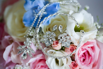 Bride's jewels on top of the wedding bouquet