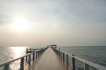 Fototapeta premium Wooded bridge in the port along sunrise at island beach.