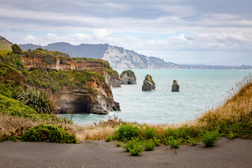 sea shore rocks and mount Taranaki, New Zealand