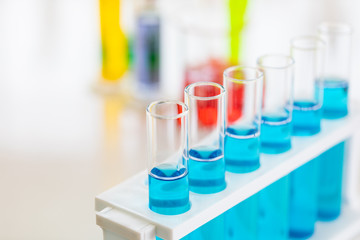 Close up shot of  blue liquid in test tubes..