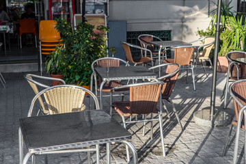 Summer street cafe with tables in the open. Cafe on the pedestrian street.