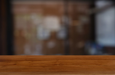 Empty wooden table in front of abstract blurred indoor house room interior background. For montage product display or design key visual layout - Image.
