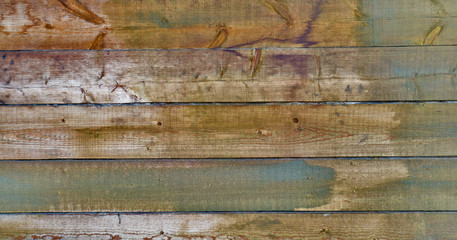 weathered fir planks on old fence, texture with vignette