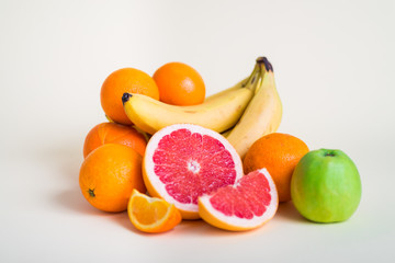 Naklejka na ściany i meble Fresh orange juice with fruits, isolated on white