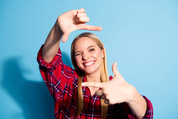 Close up photo of attractive charming lady funny making photo with index  finger thumb frame imagination feel glad have free time wear plaid outfit isolated on pastel background