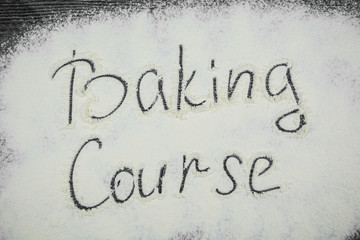 Inscription Baking Course on a black wooden board