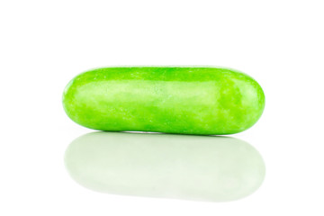 One whole green sweet licorice comfit isolated on white background
