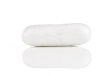 One whole white sweet licorice comfit isolated on white background