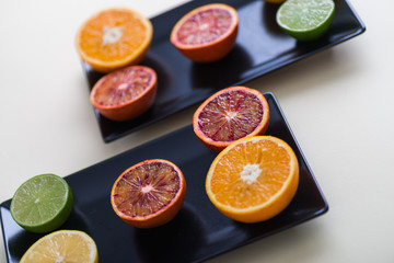 Ripe Citrus Fruit on dark backdrop. Orange, Lime, Lemon Mint. Healthy Food. Summer Background. Juicy, juice.