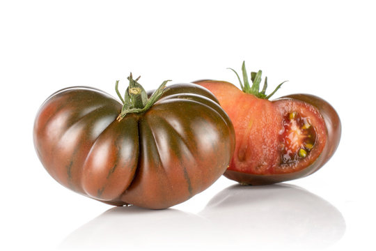 Group of one whole one half of fresh tomato primora isolated on white background