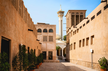 Old Dubai view with mosque, buildings and traditional Arabian street. Historical Al Fahidi...