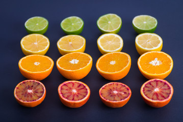 Ripe Citrus Fruit on dark backdrop. Orange, Lime, Lemon Mint. Healthy Food. Summer Background. Juicy, juice.
