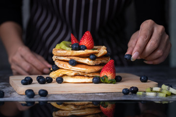 Woman preparing pancakes