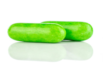 Group of two whole green sweet licorice comfit isolated on white background