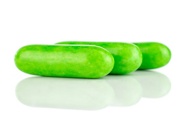 Group of three whole green sweet licorice comfit isolated on white background