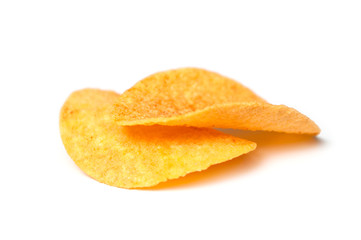 closeup of paprika chips on white background