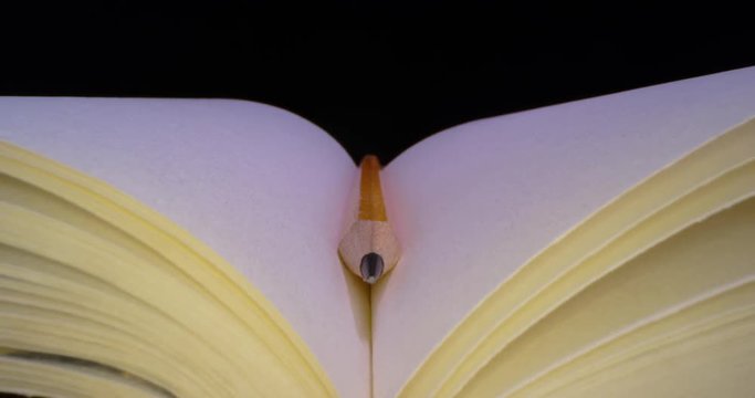 Copy book with Pencil. Sketch book. Macro Wide Angle. 4K.