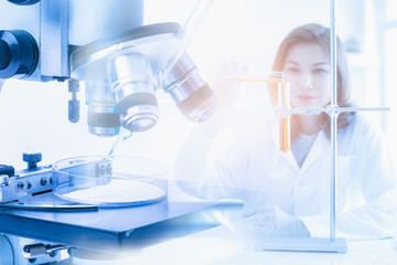 Scientist pour liquid into test tube..