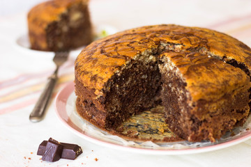Sliced tasty chocolate cake on table. Tasty chocolate  homemade cake. Tasty sweet dessert. Fresh Homemade bakery products.