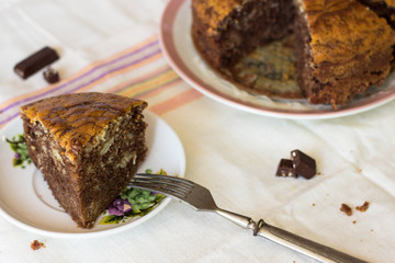 Sliced tasty chocolate cake on table. Tasty chocolate  homemade cake. Tasty sweet dessert. Fresh Homemade bakery products.