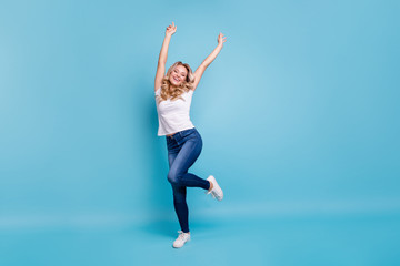 Fototapeta na wymiar Full length body size view portrait of her she nice-looking lovely attractive cheerful cheery wavy-haired lady in casual white t-shirt having fun isolated over blue pastel background