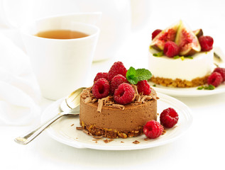 Delicious New York Chocolate Cheesecake with Raspberries. close-up.