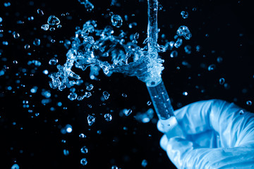 The test tube crashed in the chemical laboratory. Concept - a dangerous liquid, substance, accident,