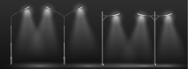 Modern city street lights row working at night 3d realistic vector. Urban electrical lightning system double and single lampposts glowing in darkness, illuminating road or path in dusk illustration © vectorpocket