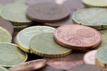 Macro of euro cents coins. Coins of fifty euro cents, twenty euro cents and five euro cents. Savings.