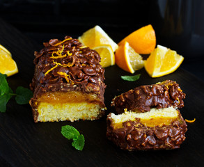 Almond-orange cupcake in chocolate glaze.