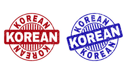 Grunge KOREAN round stamp seals isolated on a white background. Round seals with distress texture in red and blue colors. Vector rubber imitation of KOREAN tag inside circle form with stripes.