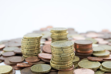 Stack of euro cents coins of different value on white background. Economy.