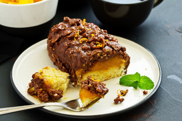 Almond-orange cupcake in chocolate glaze.
