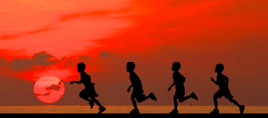 silhouette young boy running on sunset