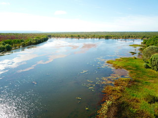 Aerial view of Lake Jabiru in dry season. Jabiru is the main township in Kakadu National Park. Green grass around the lake.