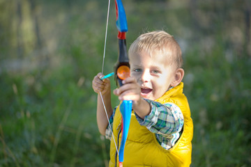  young boy with a bow