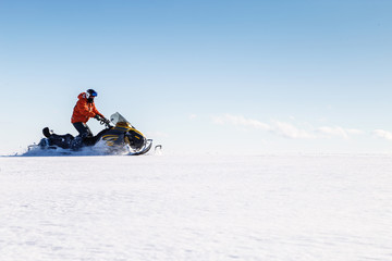 Athlete on a snowmobile.