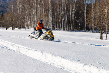 Athlete on a snowmobile.